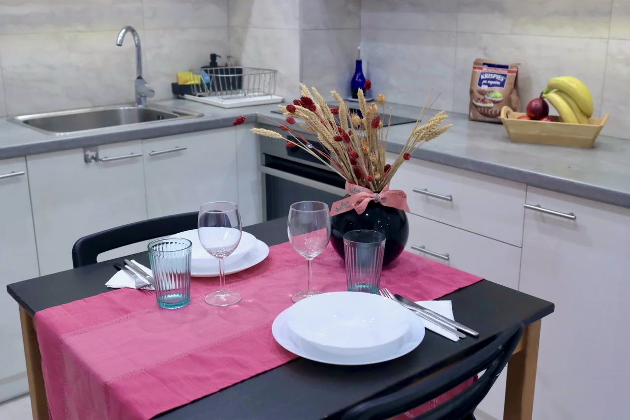 Dining area and full kitchen in the Nireos Street apartment